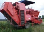 Widok z boku czerwony używany kombajn do ziemniaków GRIMME 1-rzędowy rok prod 1992 korbanek.pl
